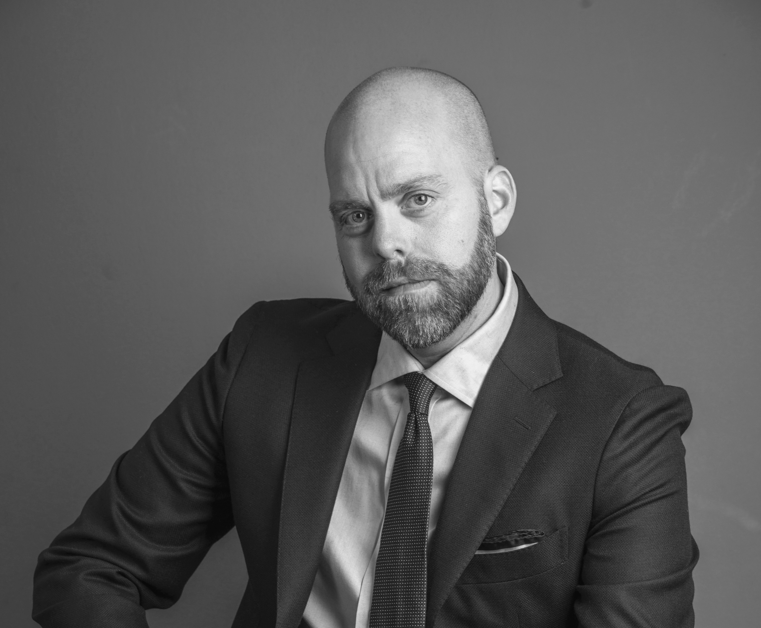 Professional portrait of Adam King: Founder & Chief Strategist
